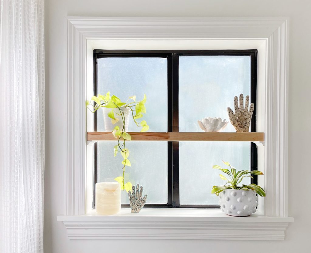 Frosted Bathroom Window With Floating Wood Shelf In Sill