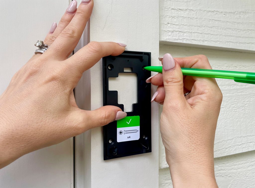 Using Pencil to Mark Holes On Ring Doorbell Mounting Plate