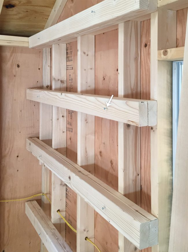 temporary screws into horizontal shelf supports for garage shelving