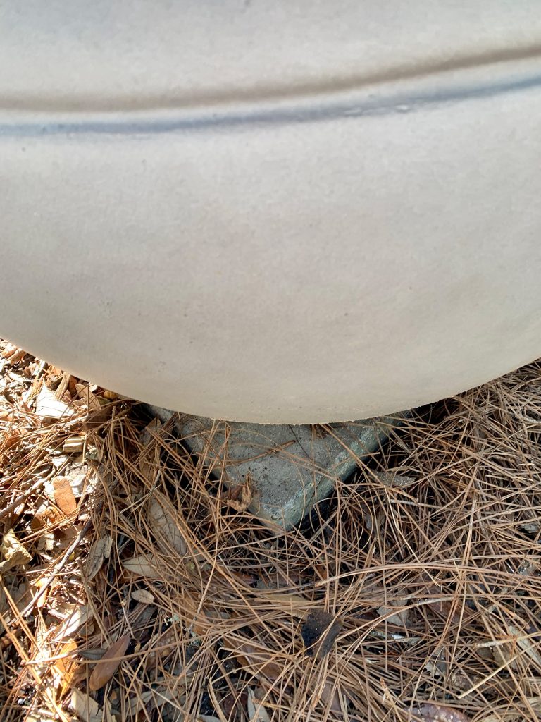 Detail of stone paver patio underneath fire pit